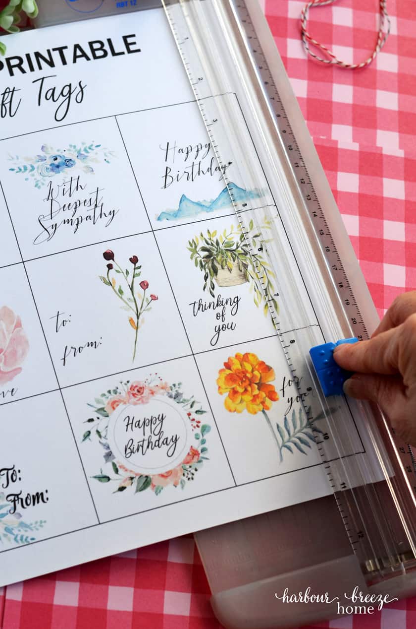 A paper cutter can be used to cut apart the square gift tags quickly by following the cut guide lines.