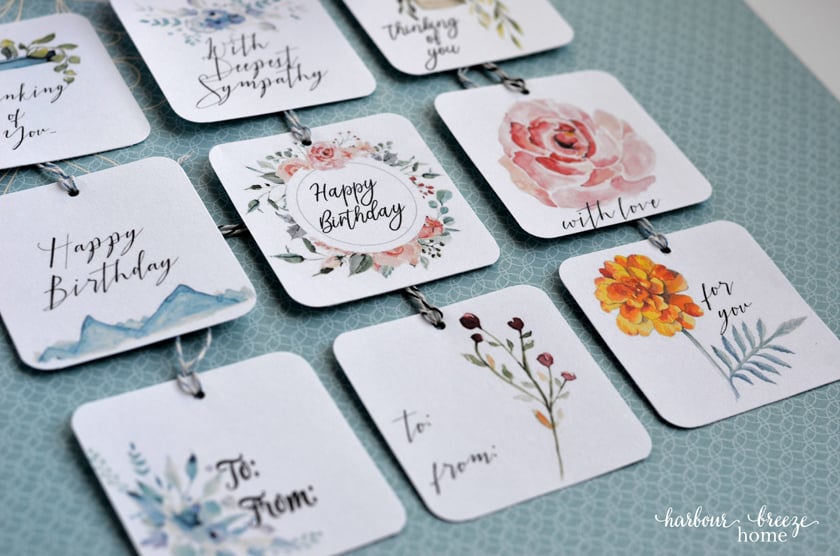 These pretty tags include watercolor pictures of flowers, plants, and mountains.