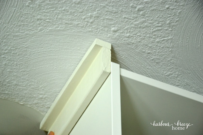 attaching side piece of molding to the billy bookcase