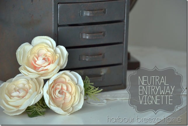 neutral entryway vignette with words