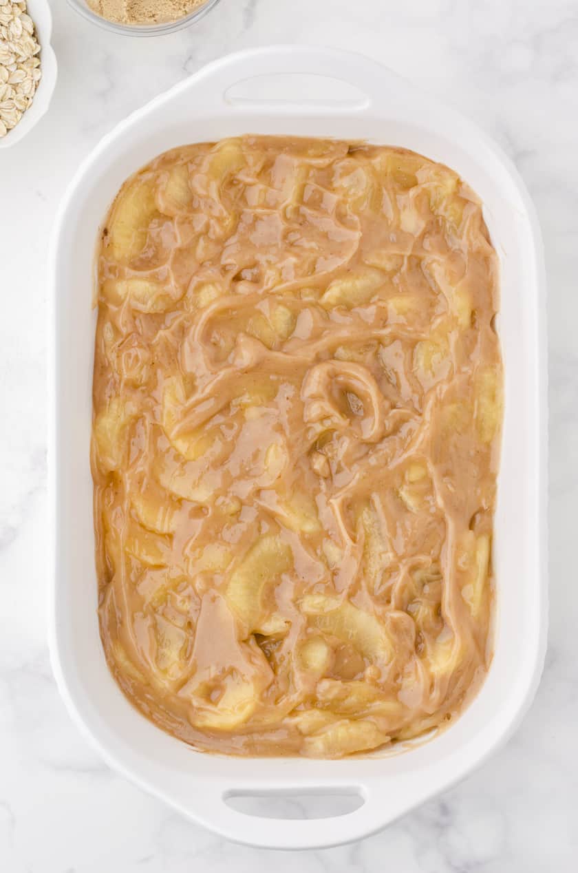 the apple pie filling base for apple crisp with pie filling in a 9x13 inch pan