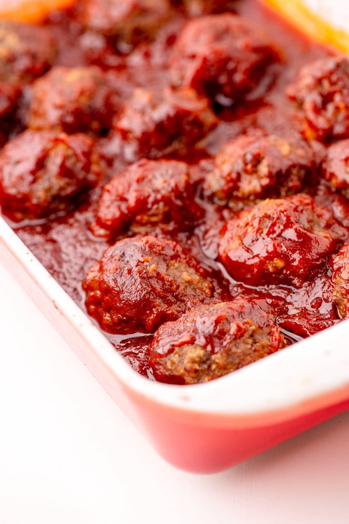 Baked meatballs with homemade barbecue meatballs sauce.