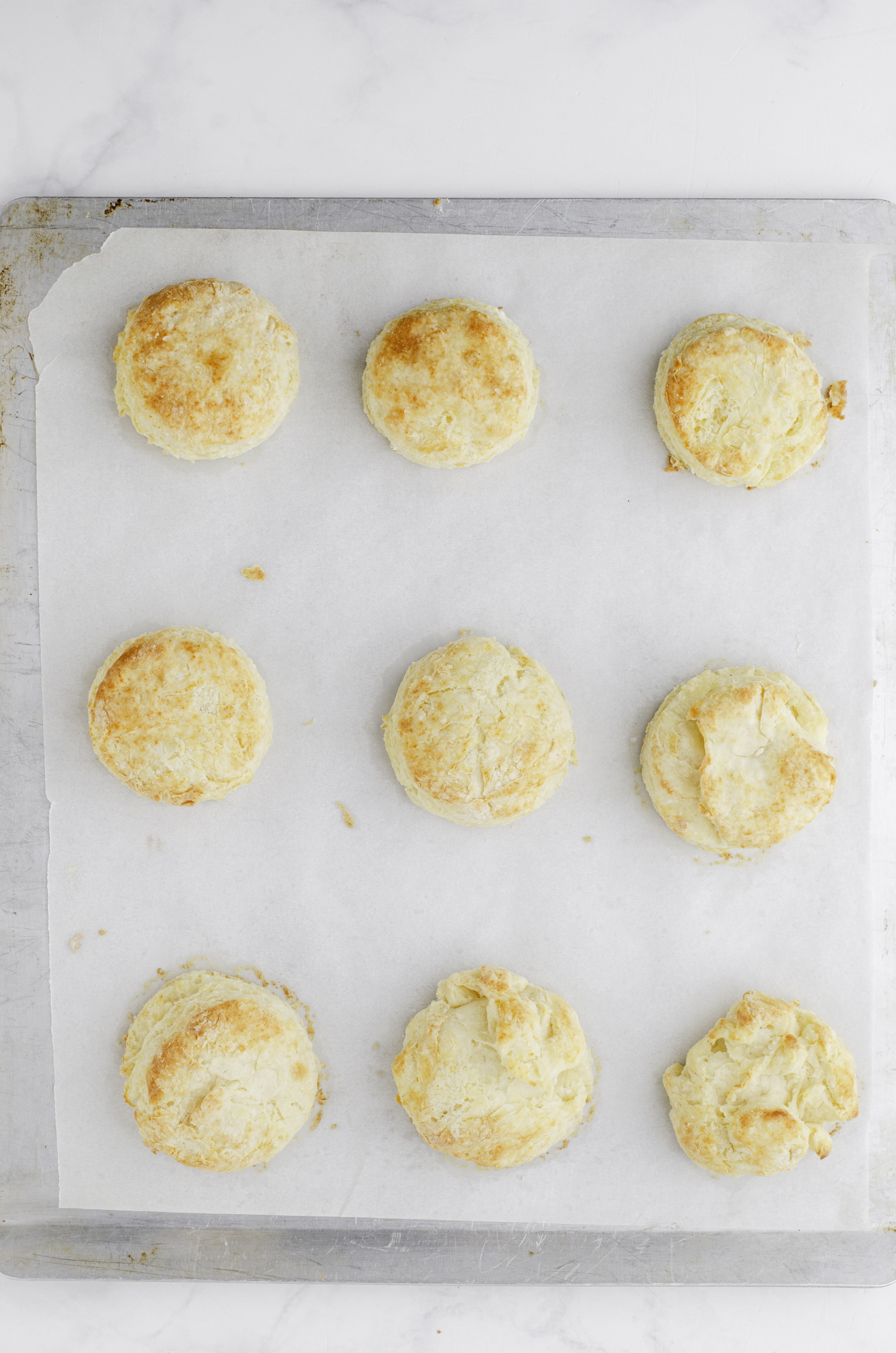 a pan of baked biscuits right out of the oven.