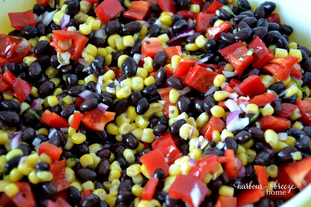black bean salad with corn and avocados in a bowl