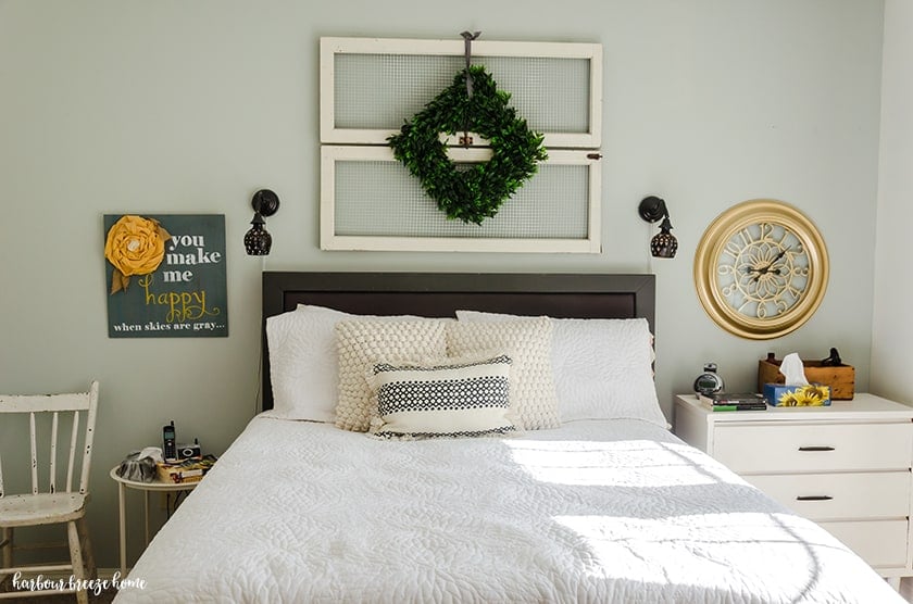 Bedroom with a dresser beside one side and a table and chair on the other.