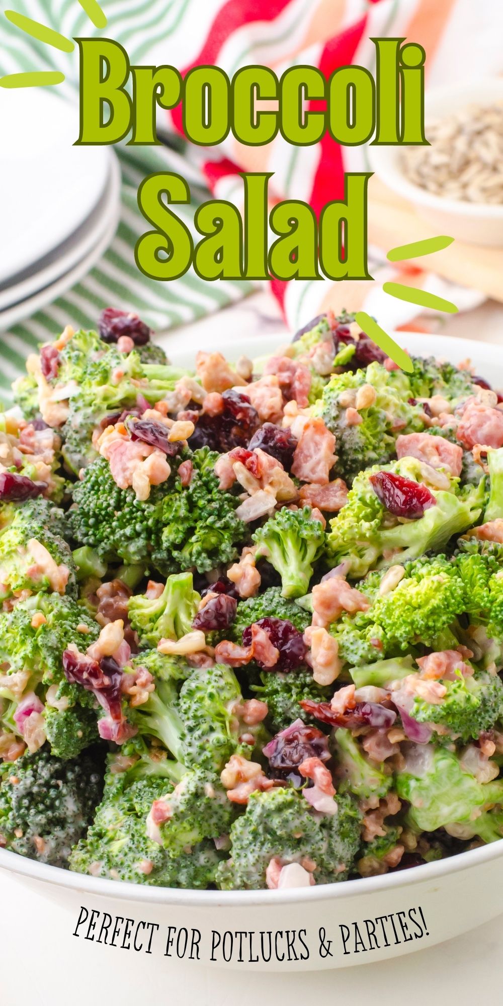 white bowl with broccoli salad with cranberries, bacon, and sunflower seeds with a Miracle whip creamy dressing