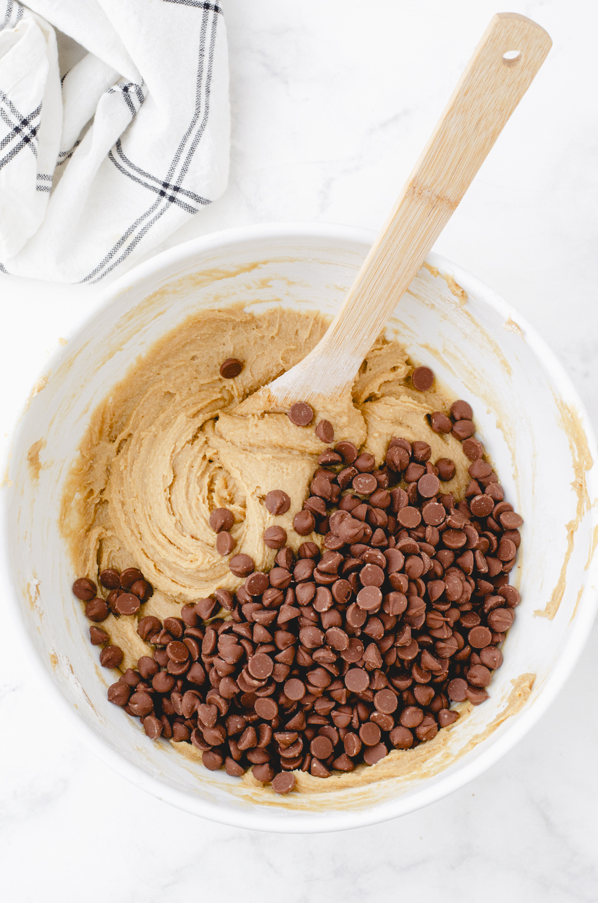 chocolate chips poured on the top of butterscotch brownie batter