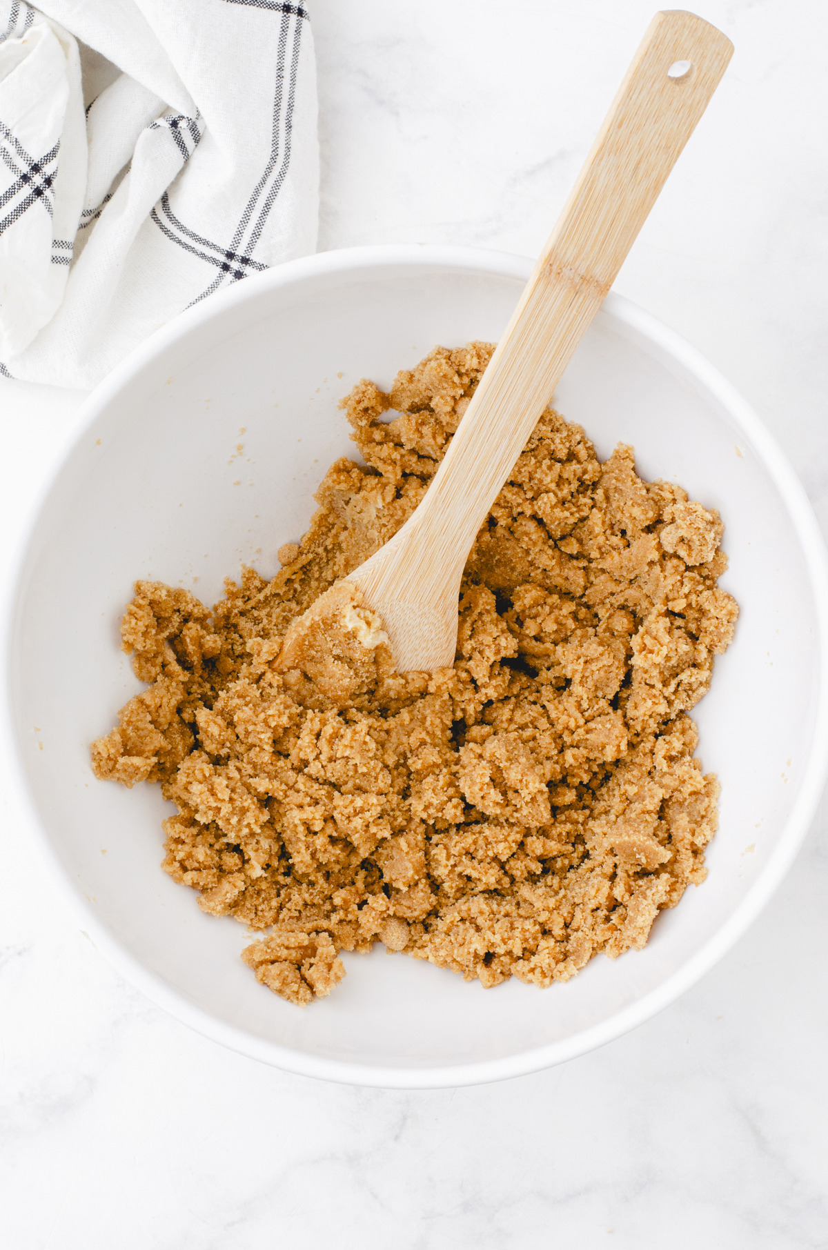 Light brown sugar and butter stirred together in a large mixing bowl as the first step to making butterscotch brownies