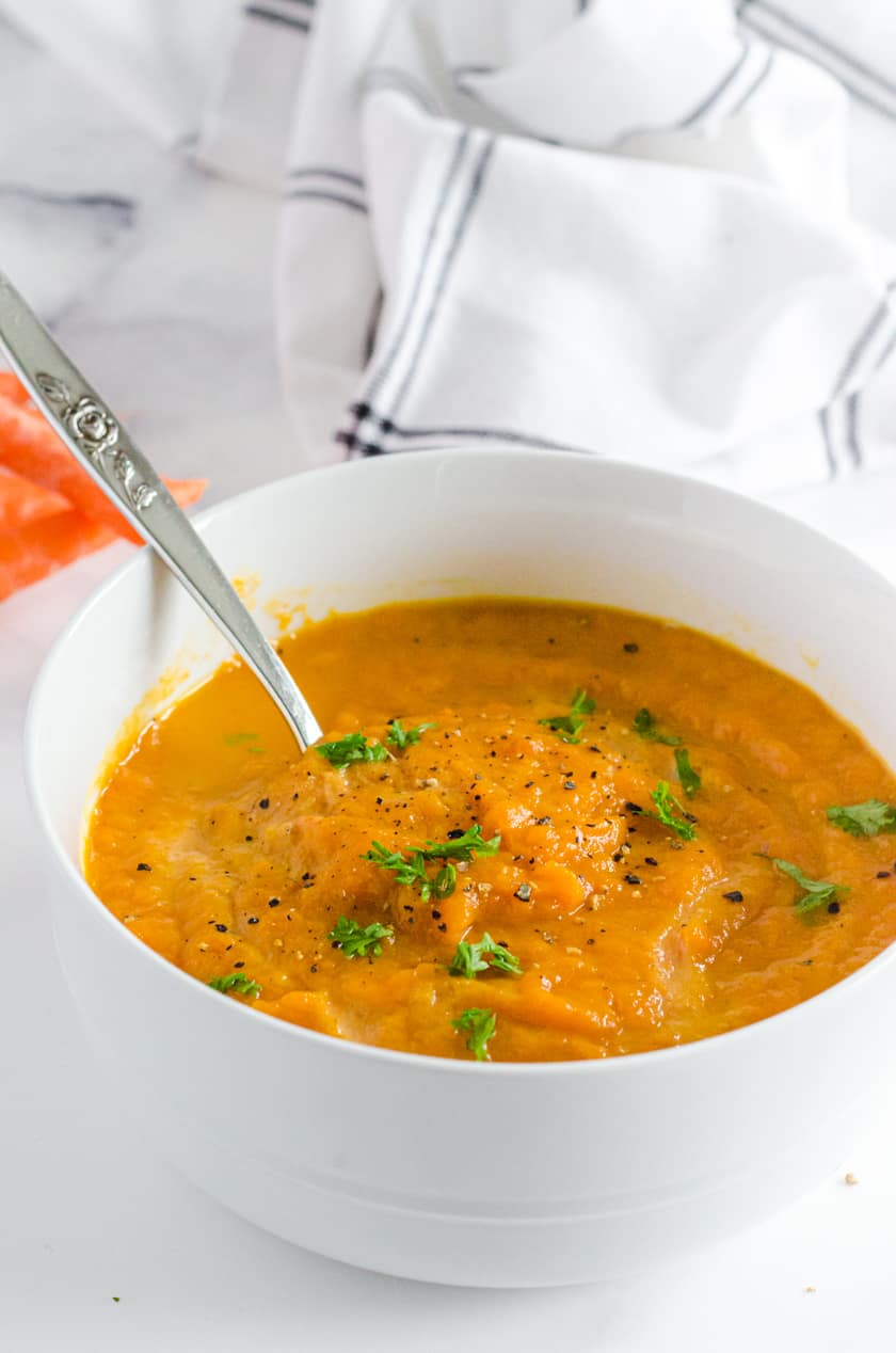 Creamy Curry Cajun Carrot Soup in a white bowl