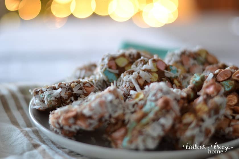 Church window cookies on a plate with colored marshmallows and coconut.
