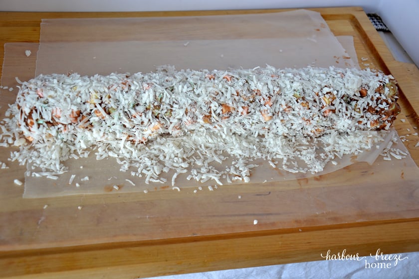 church window cookies in a roll covered in coconut on wax paper