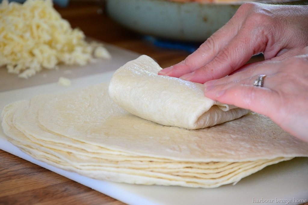A chicken chimicanga being folded.