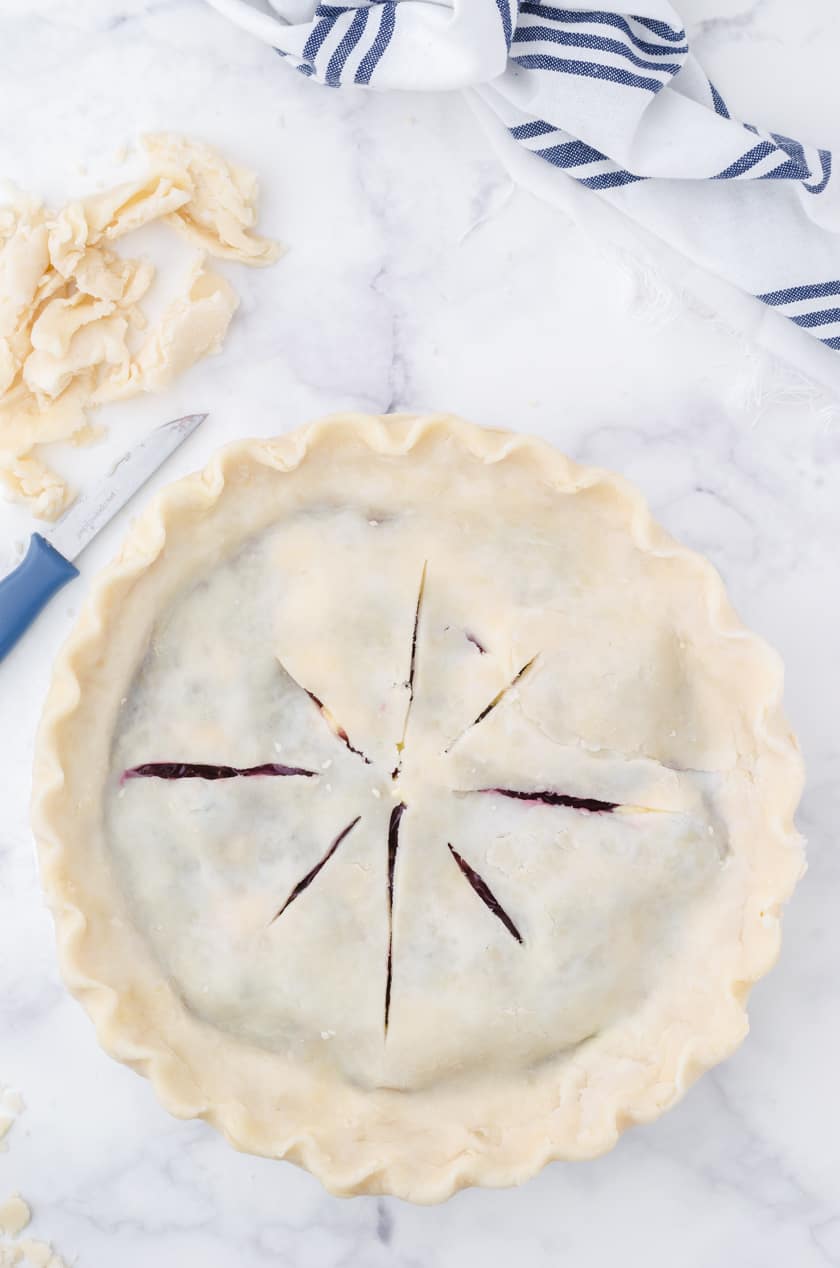 Unbaked homemade cherry pie ready to put in the oven