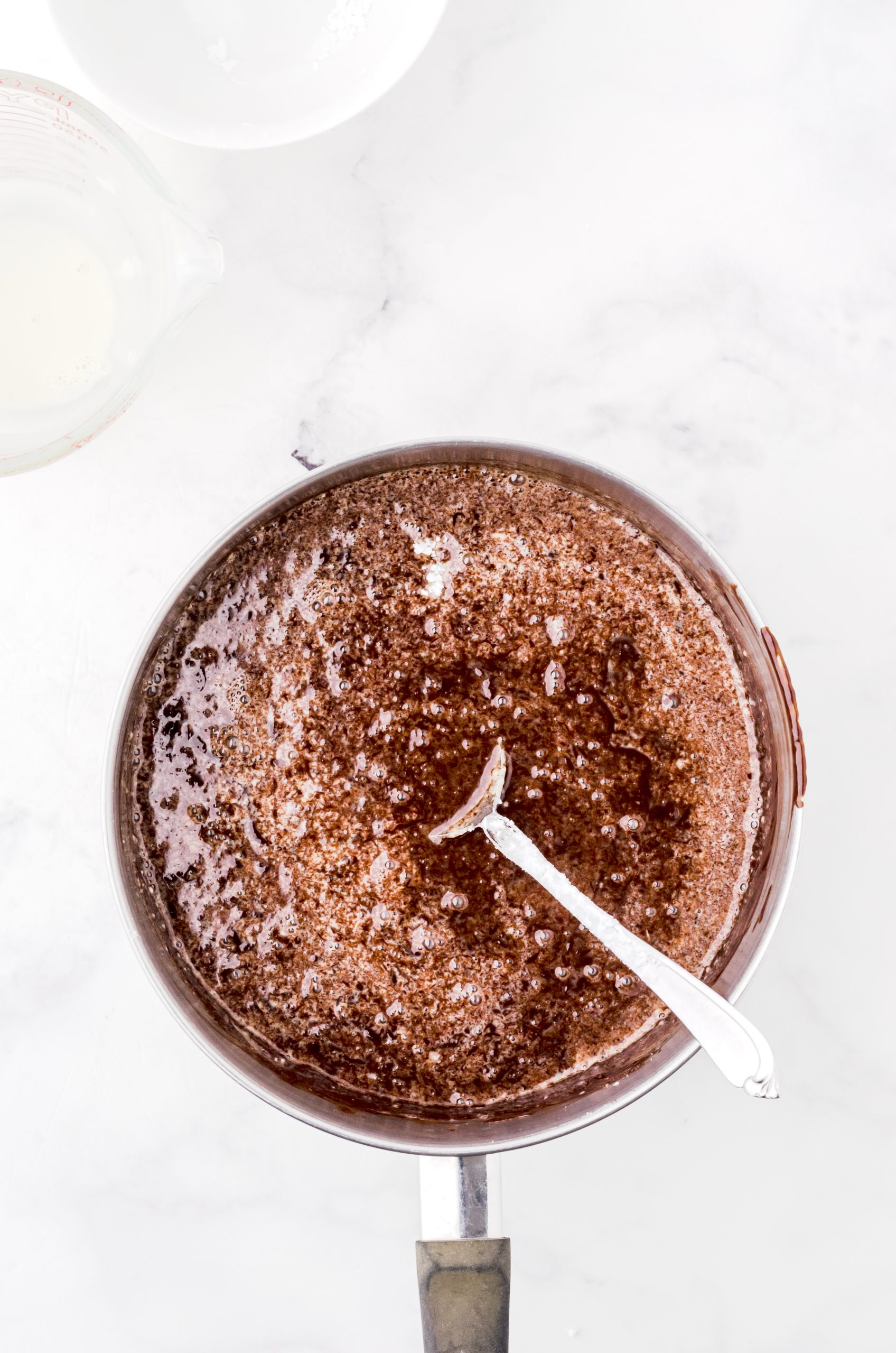 boiling hot fudge sauce in a saucepan