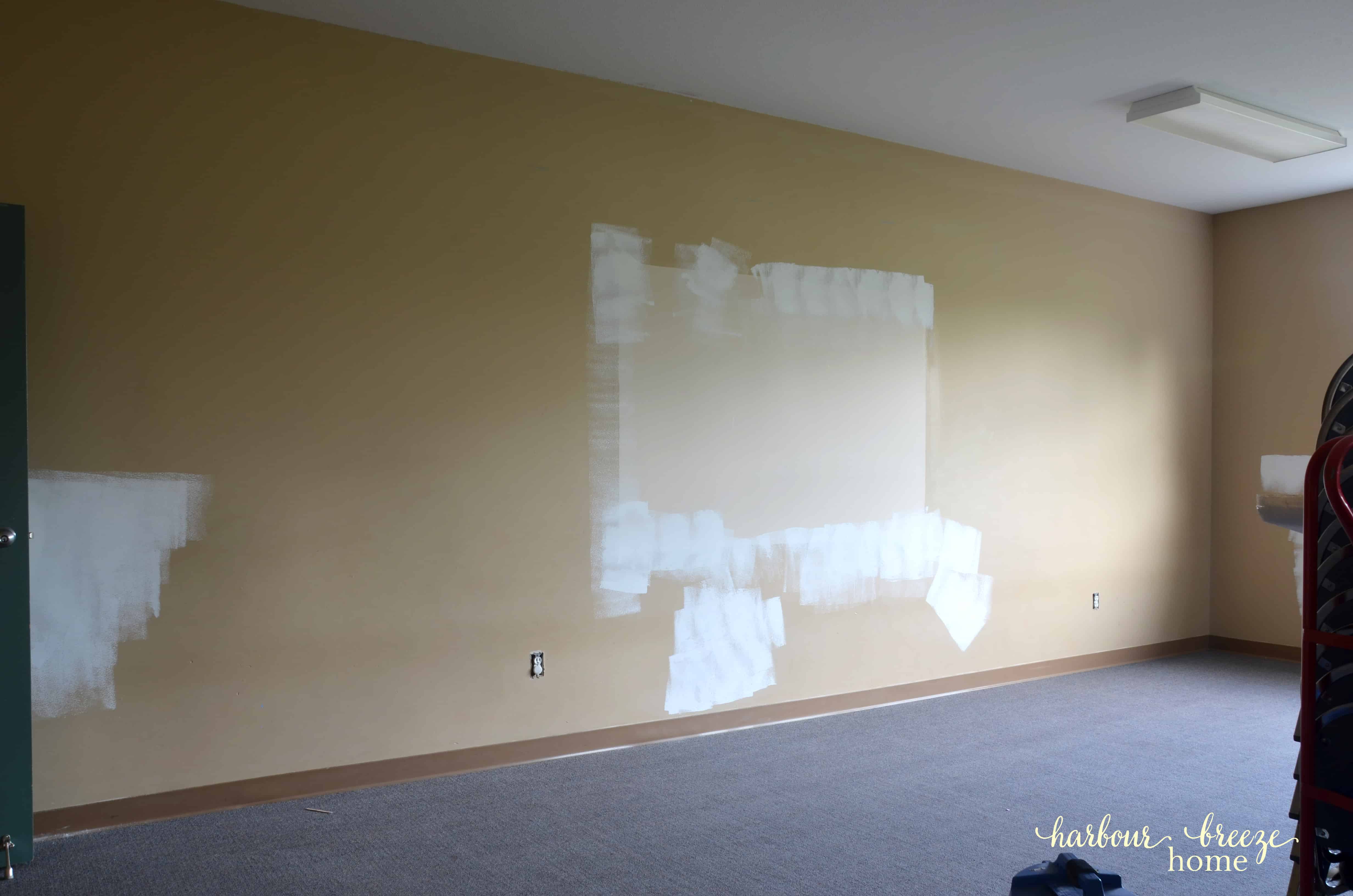 Classroom wall with patches of wall repairs