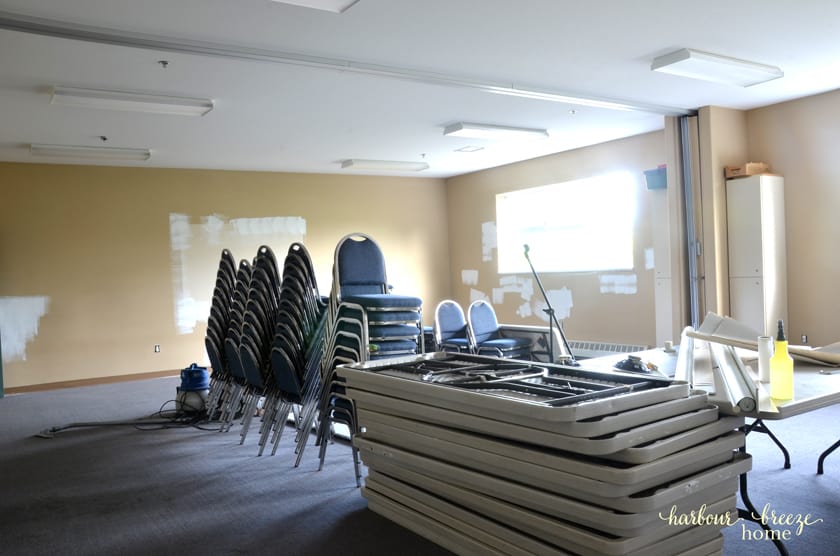 A large classroom in need of fresh painted walls.