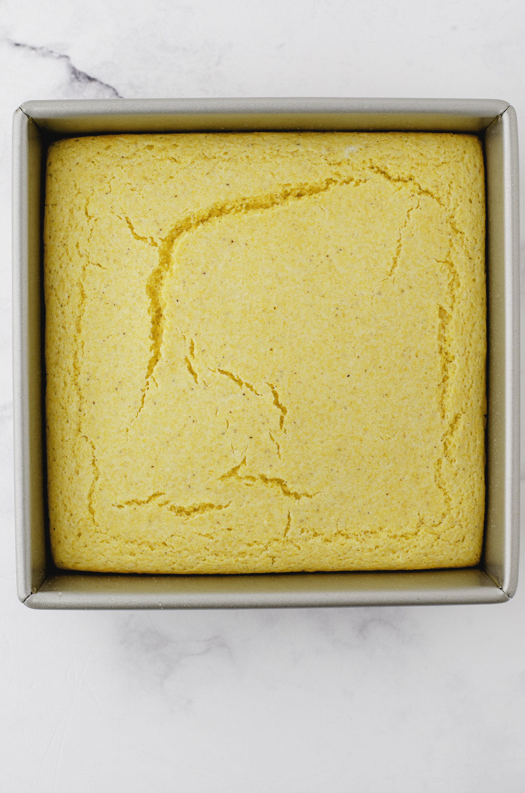 Baked cornmeal cornbread without buttermilk in a 8 x 8 inch pan