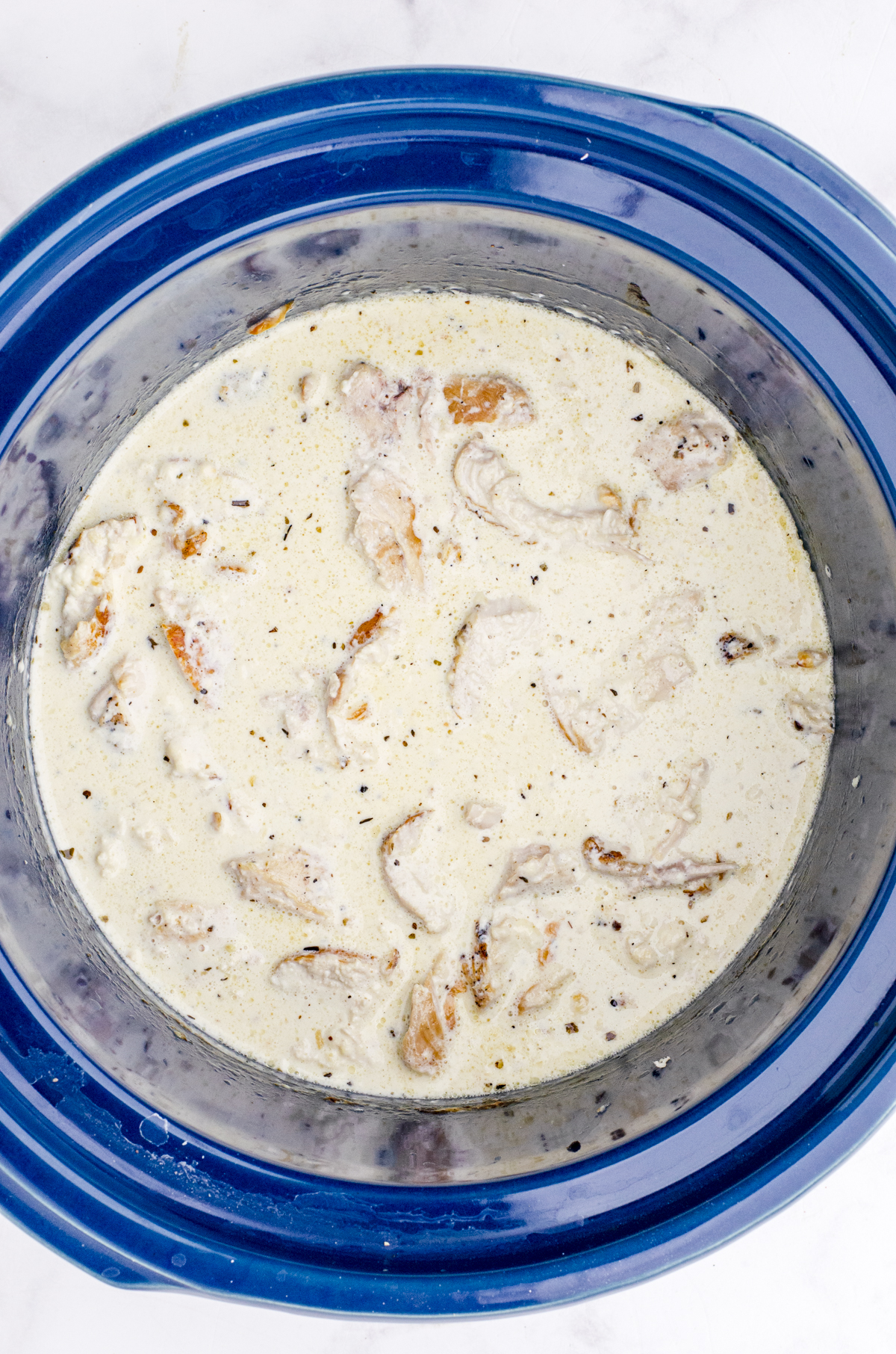 Chicken alfredo sauce in a crockpot