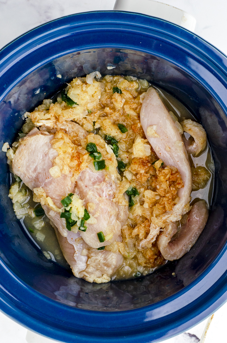 Hawaiian Crock Pot shredded chicken ingredients in a crock pot before they are cooked.