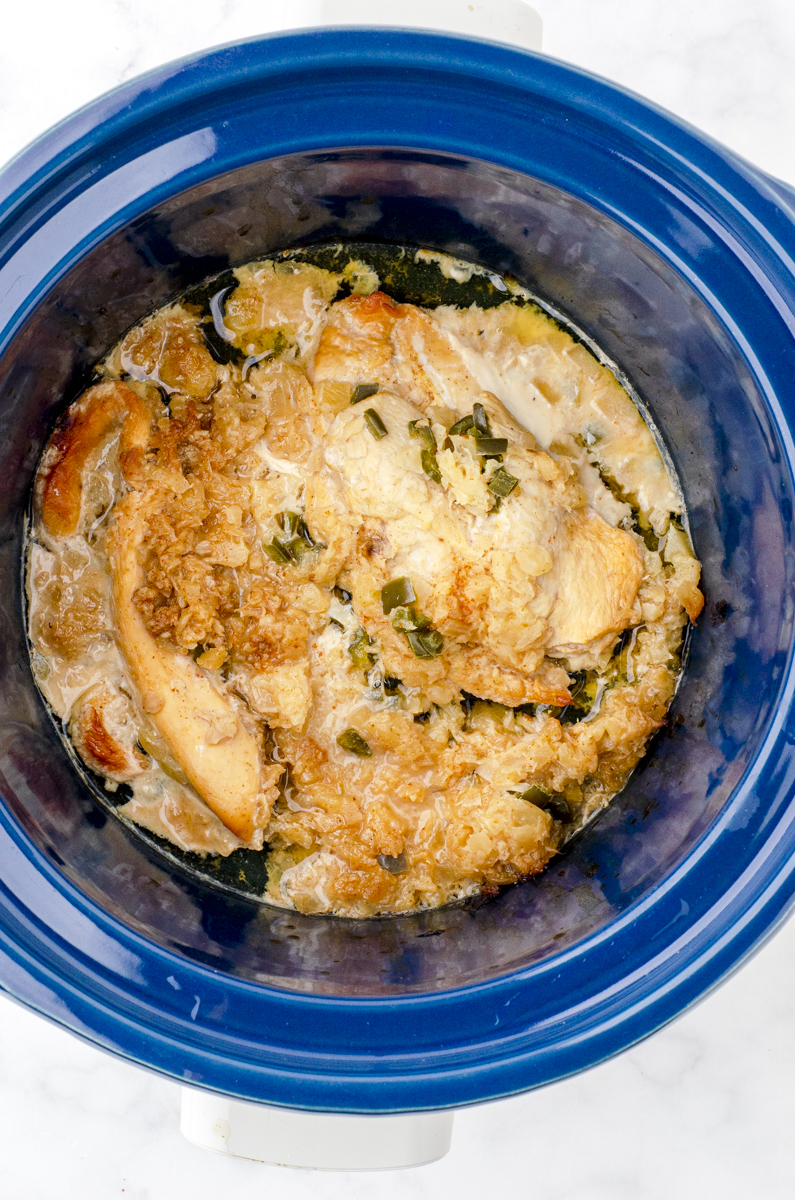 Crock pot shredded chicken cooked in a crock pot but not shredded yet.