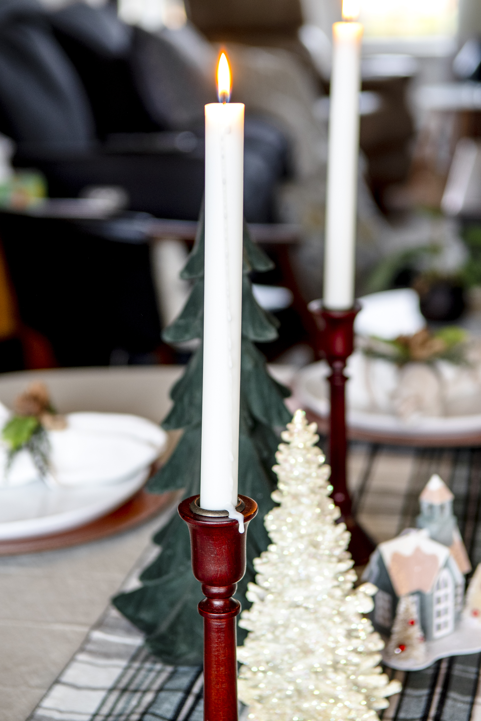 2 taper candles with a green velvet tree in between to make a centerpiece for a Christmas tablescape