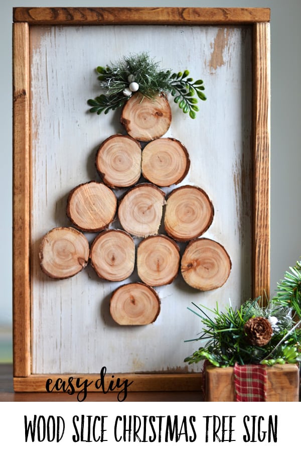 a wood slice christmas tree sign