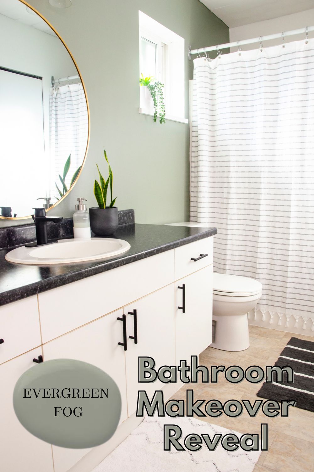 A bathroom painted in the color evergreen fog by Sherwin Williams.