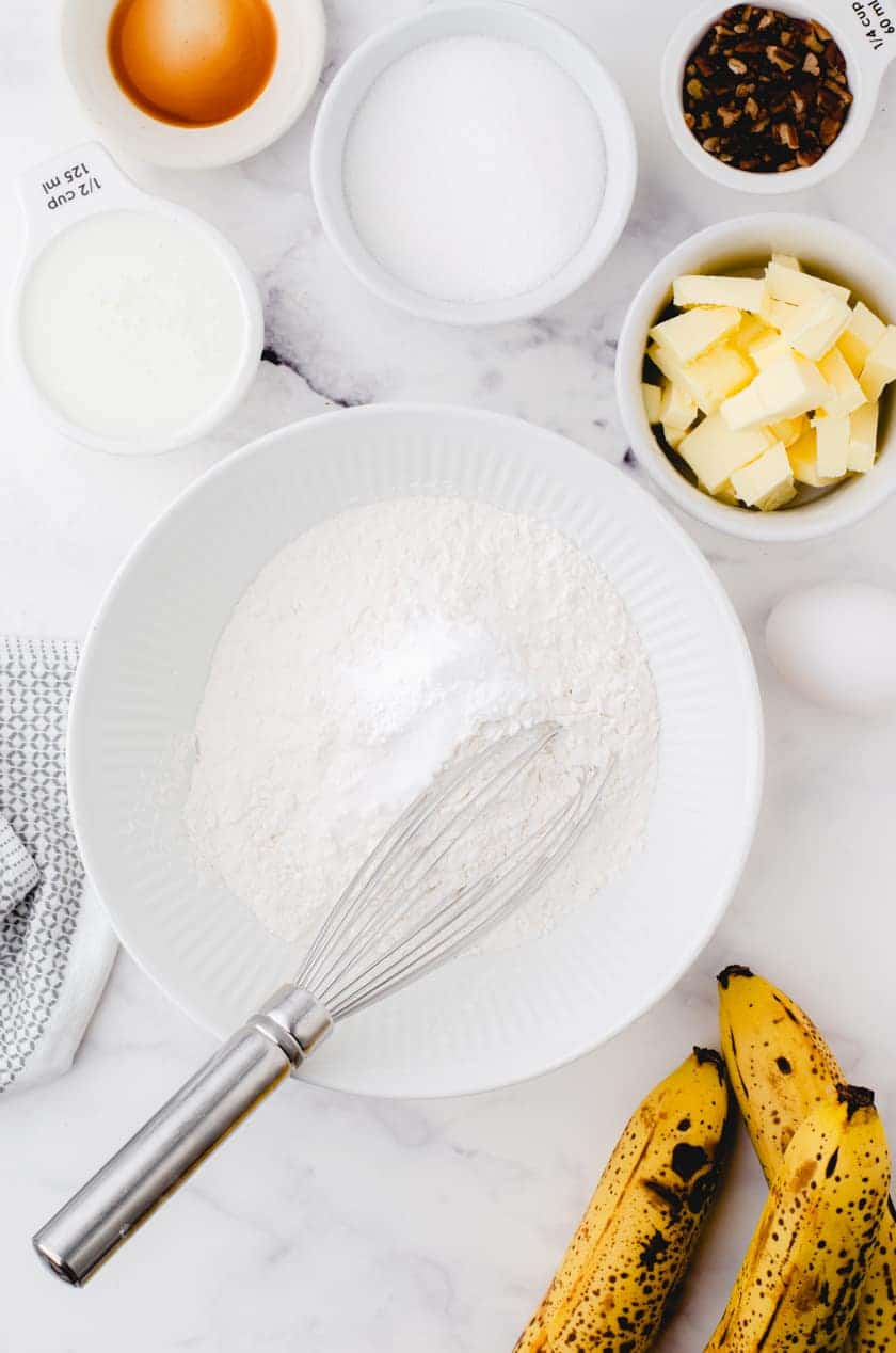 Step one in buttermilk banana bread recipe - mix together dry ingredients.