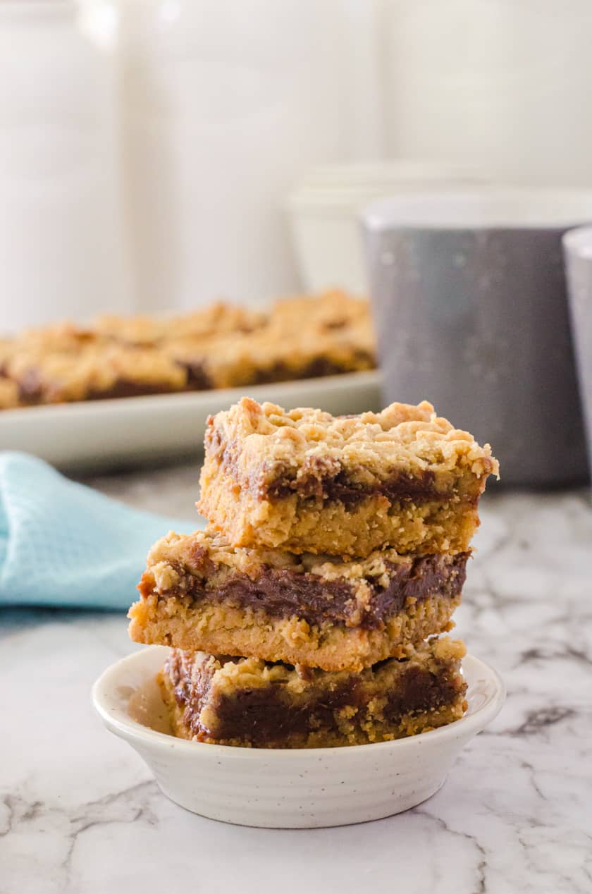Three peanut butter fudge bars stacked up
