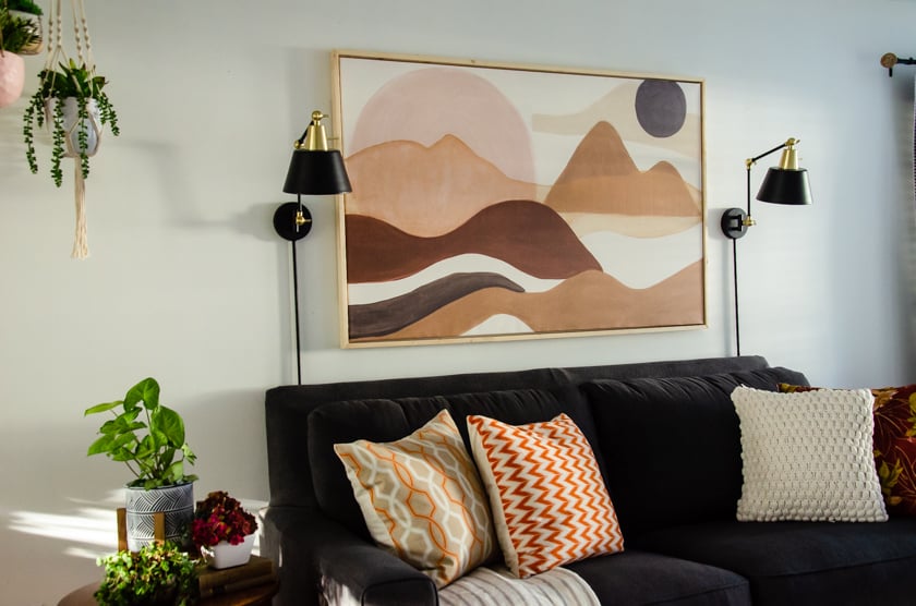 Canvas with floating frame hung above a couch