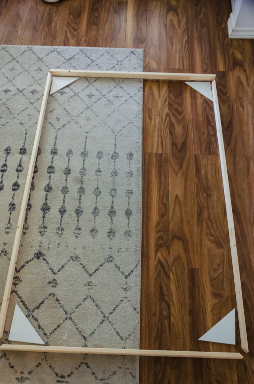 The wood pieces needed to create a floating frame for art canvas