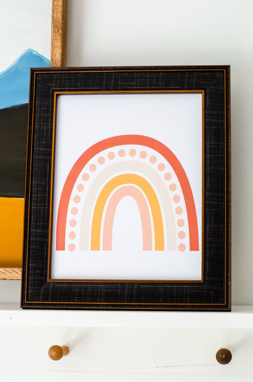A 8 x 10 inch boho rainbow printable art print in a frame.