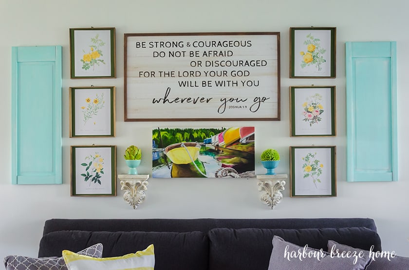 vintage printable art - yellow rose botanical prints-hung in an arrangement above a living room couch