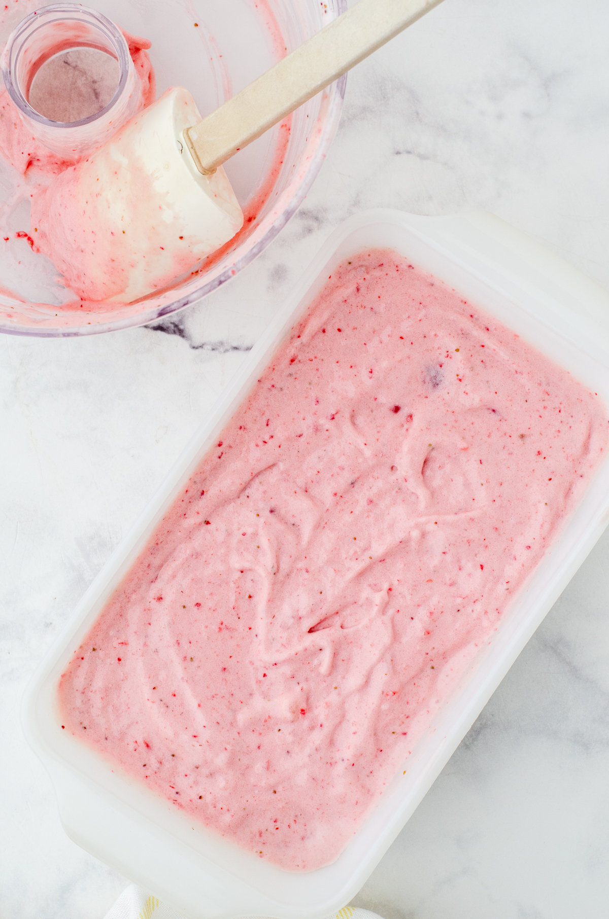Homemade frozen yogurt spread into a loaf pan