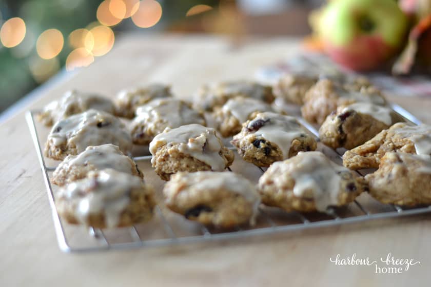 Glazed fresh apple cookies on a wire cooling rack.