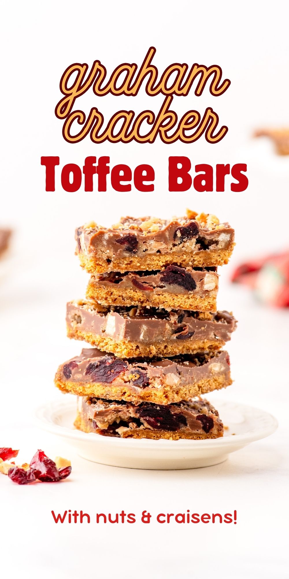 a stack of graham cracker toffee bars with almonds and dried cranberries.