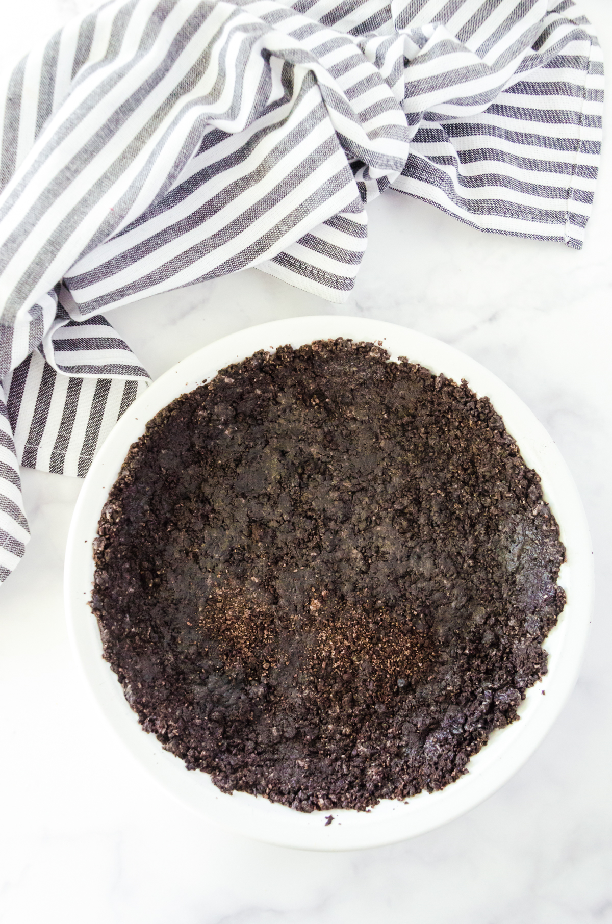 oreo crust pressed into a pan pan
