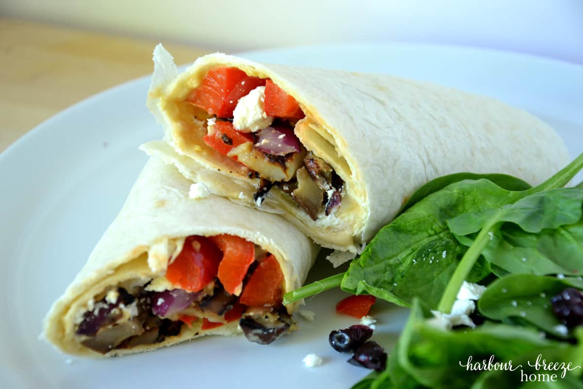 vegarian wraps with grilled vegetables on a plate.