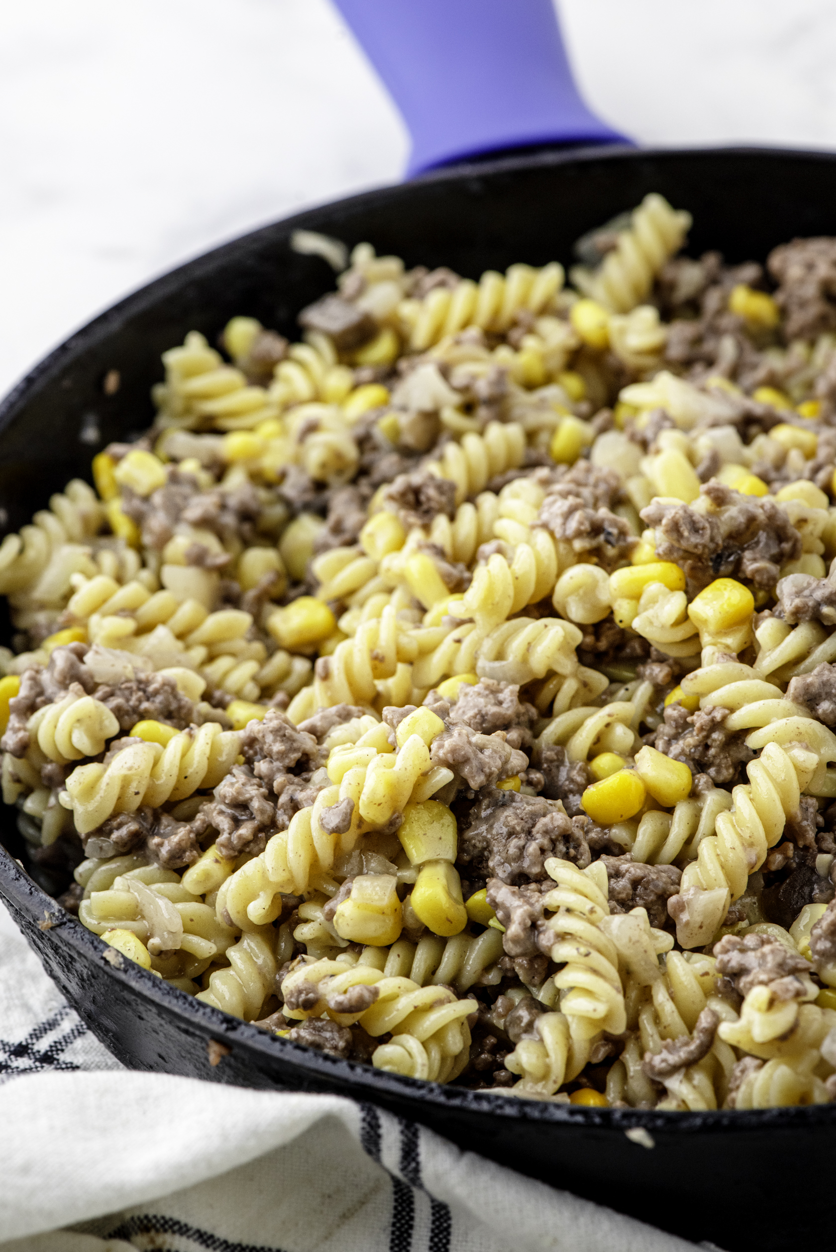 Homemade hamburger helper recipe in a cast iron skillet.