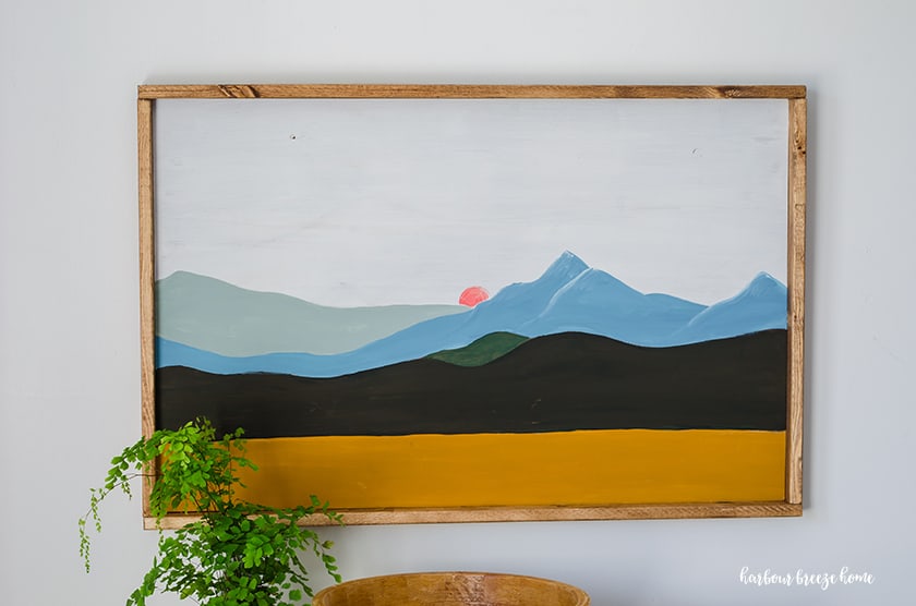Painting of a mountain scene in color block modern art method.