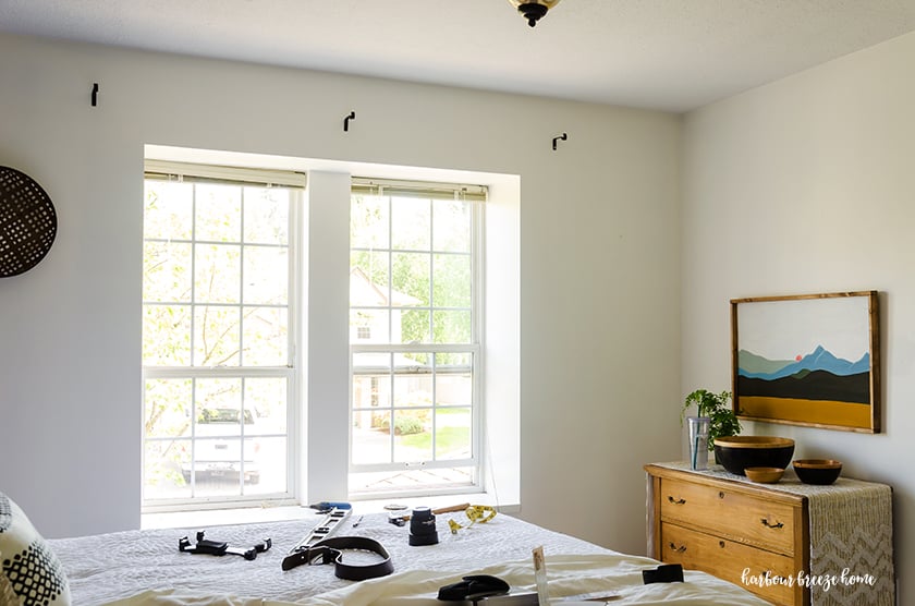 Where curtain rod brackets are placed above a window so that the window and room feel larger.
