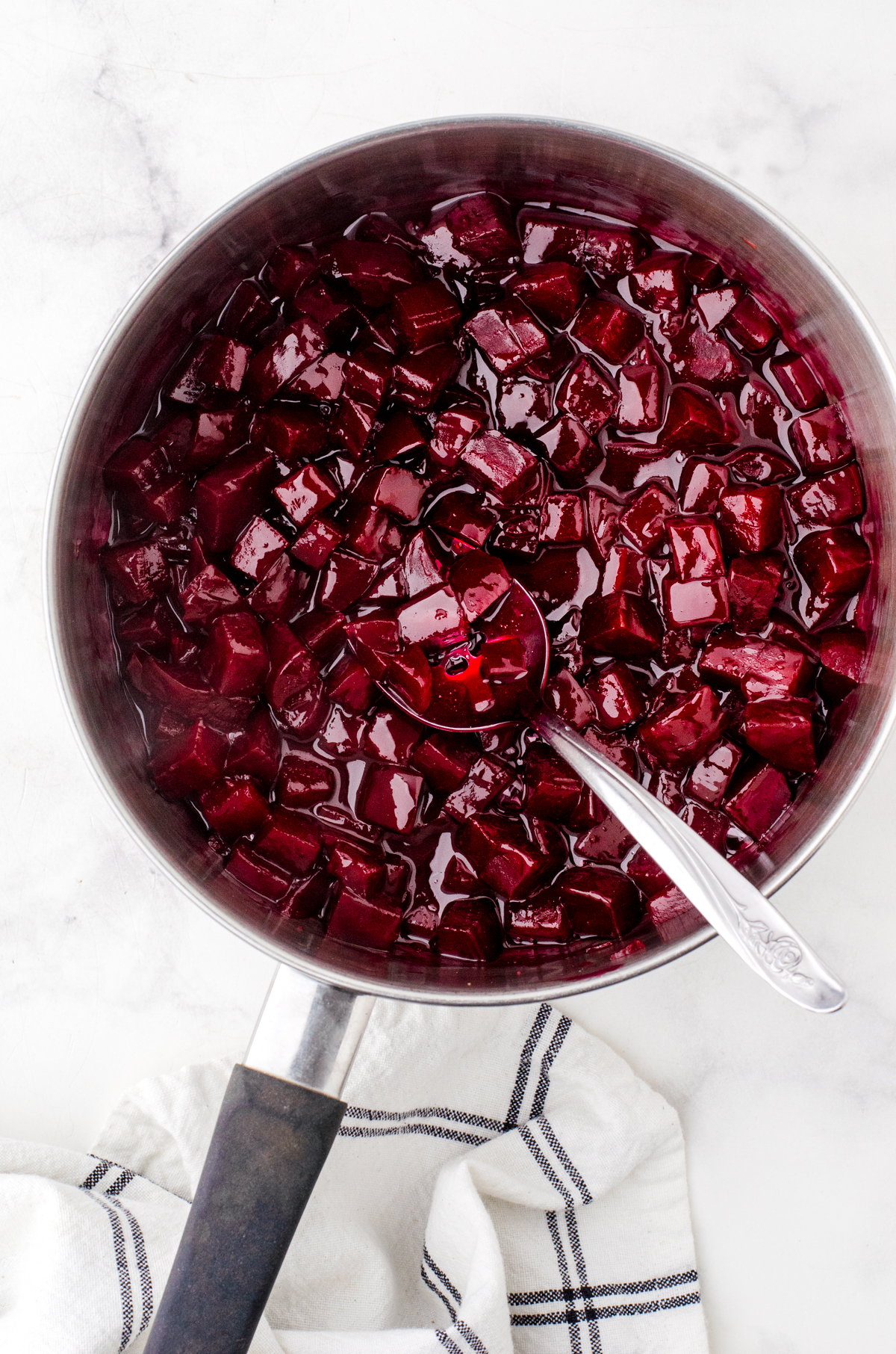 Cooked harvard beets in a saucepan.