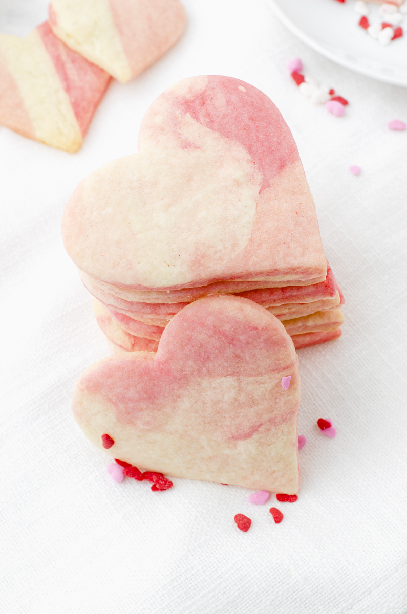 Heart sugar cookies stacked up.