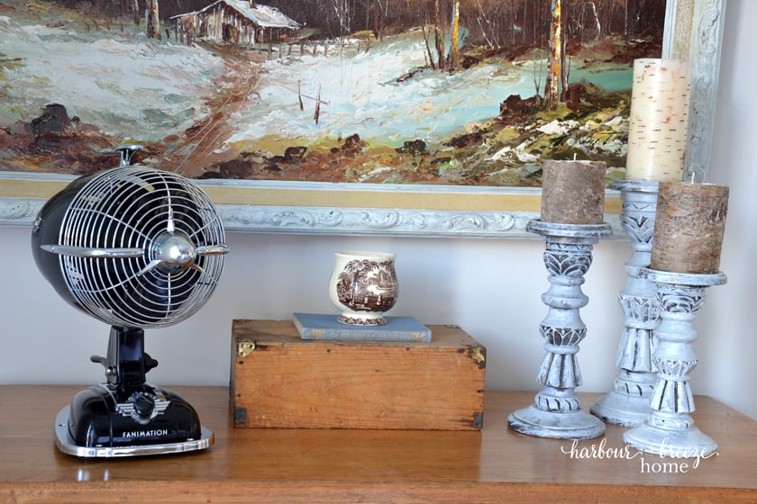 how do I style a fan on a master bedroom dresser top?