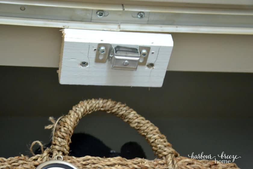 a magnetic latch that allows the bi fold french doors to stay shut