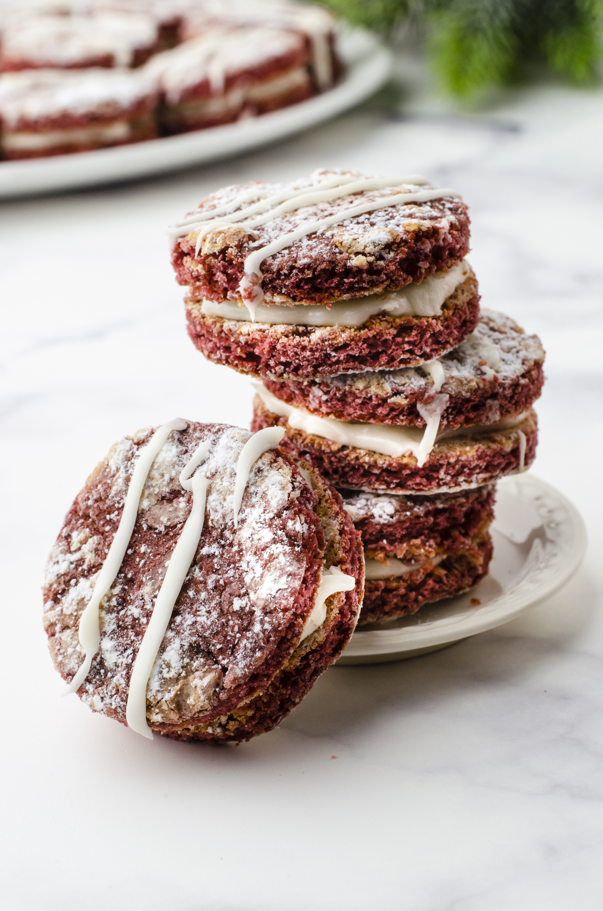 Red Velvet Crinkle Whoopie Pie cookies stacked up.