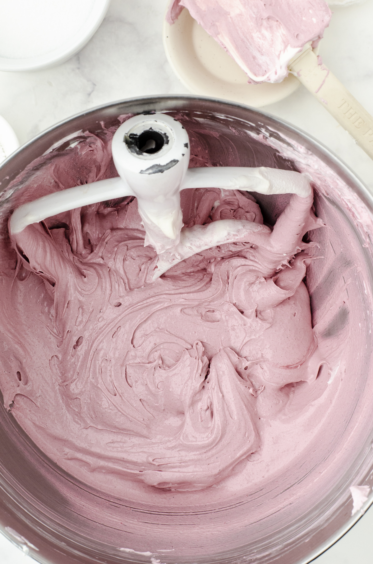Red Velvet Cookie dough in bowl of mixer.
