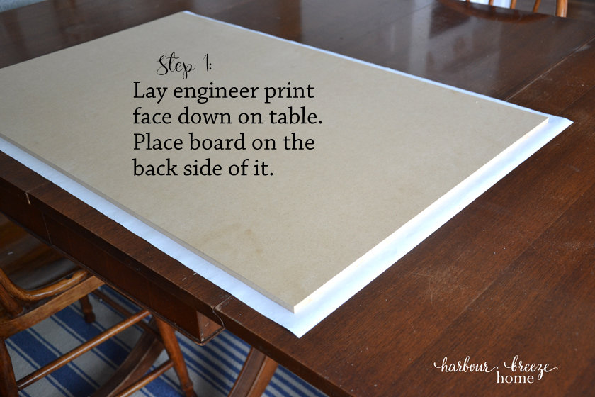 an engineer print laying face down on a table with an mdf board on it