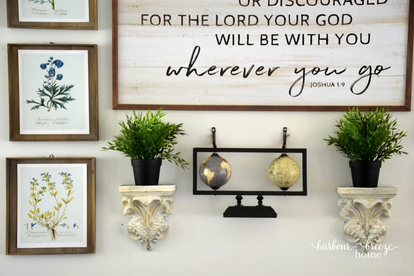 close up of a portion of the gallery wall arrangment above a couch