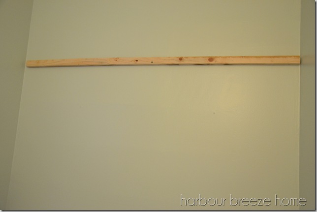 the bottom of a french cleat attached to a wall